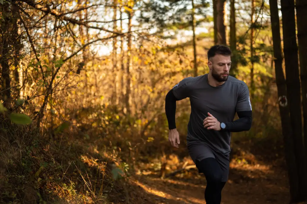 young man running outdoors in the nature