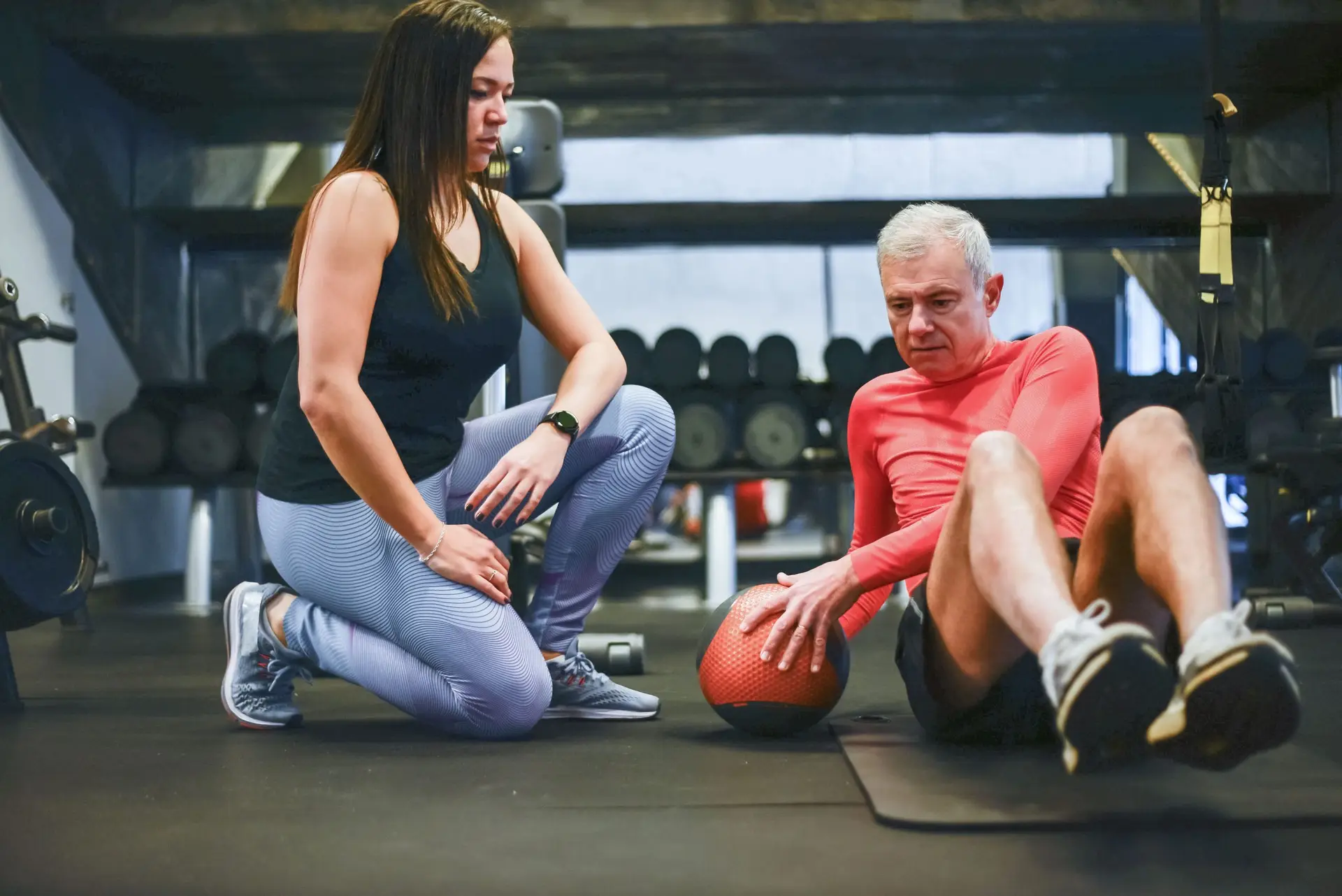 personal trainer working out with client in midtown toronto condo gym